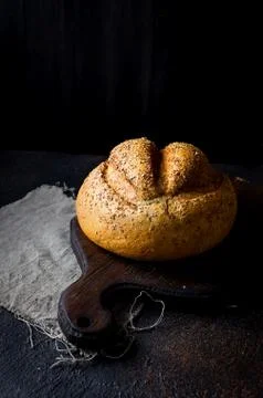 Bread loaf on black background Stock Photos