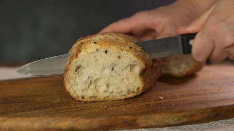 Bread, loaf, breakfast, cutting with a a knife Stock-Footage 130117755