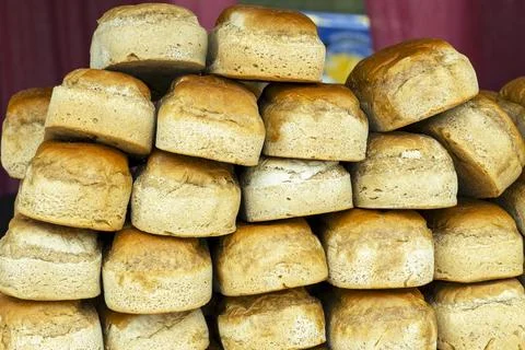 Bread loaves in a row. Breads and baked goods close-up.   view of loaves . .. Stock Photos