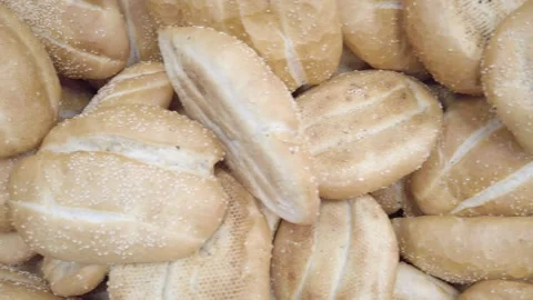 Bread loaves stacked at bakery pan left Stock Footage 328339048