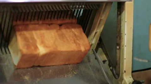 Bread machine cutting into slices 스톡 동영상 12176389