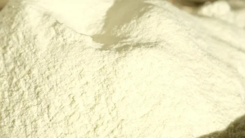 Bread making: adding dry yeast to flour Stock Footage 80485919