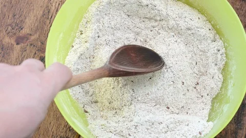 Bread making process Top view of hands with wooden spoon and rye wheat flour mix Vídeos de archivo 115441932
