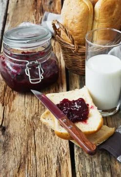 Bread, milk and cherry jam Stock Photos