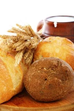 Bread, milk and wheat ears. Stock Photos