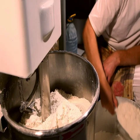 Bread Mixer In Bakery, mixing dough for baguettes in a bakery machine for mixing Stock Footage 69623434