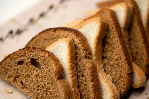 Bread mixture. Assorted slices or set of wheat and rye bread. Horizontal format Stock Photos