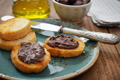 Bread with olive pate Stock Photos