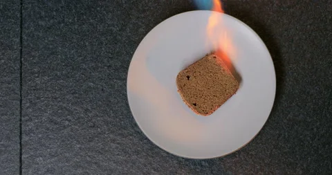 Bread on an open fire. Pieces of brown bread are grilling on the open fire. Stock Footage 228677850