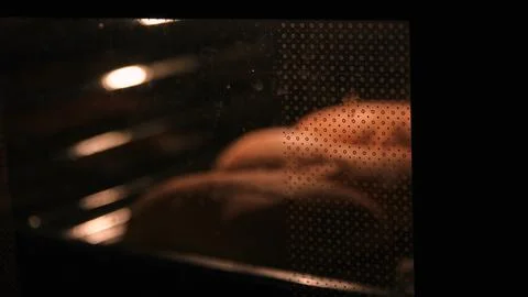 Bread in the oven in a blur. Culinary background, banner. Stock Photos