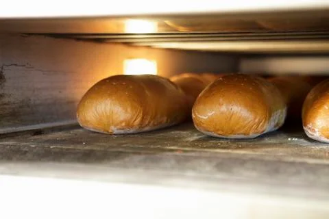 Bread in an oven Stock Photos