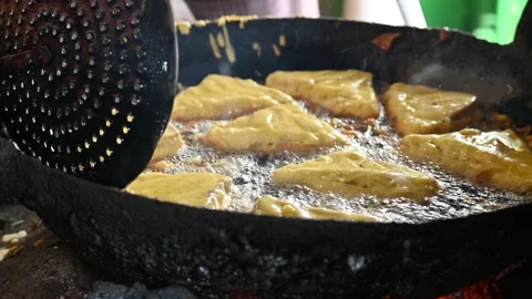 Bread pakora is being fried in hot oil. Stock Footage 296802841