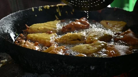 Bread pakora is being fried in hot oil. Stock Footage 296821984
