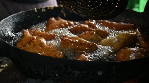 Bread pakora is being fried in hot oil. Stock Footage 296822049