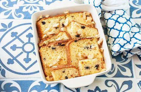 Bread (panettone) pudding from leftovers with custard and raisins in a baking Stock Photos