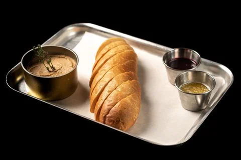 Bread with pate on a tray, black background Stock Photos