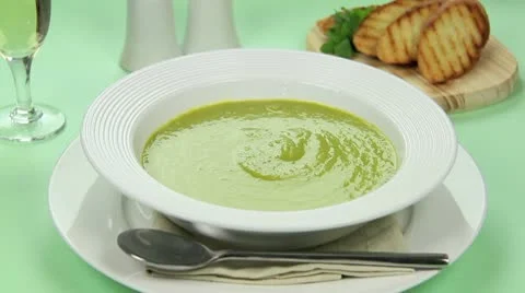 Bread Into Pea Soup Stock Footage 9177688