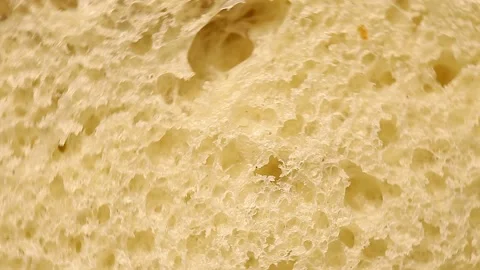 Bread piece cut off, macro view, the structure of the baked dough inside Stock-Footage 149114246