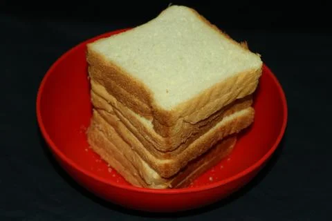 Bread pieces with black background Stock Photos