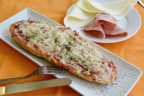 Bread pizza with ham and cheese Stock Photos