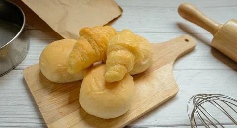 Bread placed on a white wooden table background Stock-Fotos