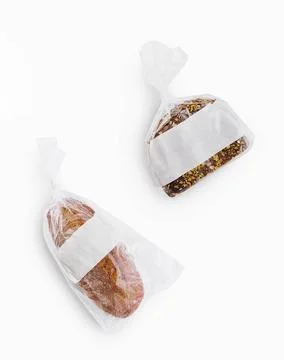 Bread in plastic bags on top view Stock Photos