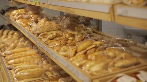 Bread products on a shelf in a bakery, bread Stock Footage 75474968