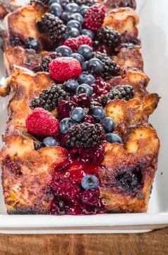 Bread pudding with berry topping Stock Photos