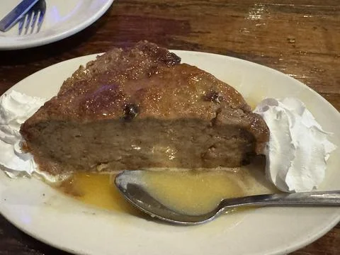 Bread pudding slice of pie with sauce  - dessert food Stock Photos