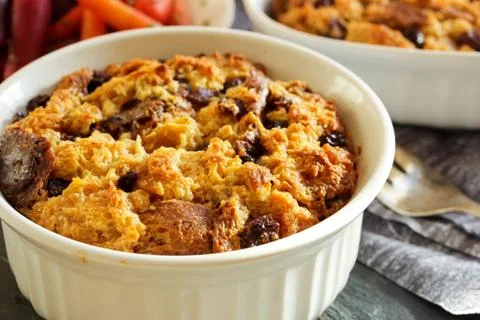 Bread pudding in a white ramekin close up view 스톡 사진