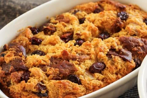 Bread pudding in a white ramekin close up view Foto stock