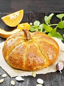 Bread pumpkin on a black board Stock Photos