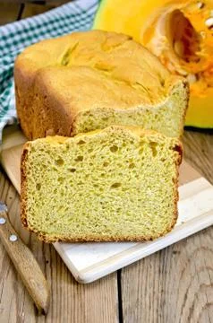 Bread pumpkin on a board with a pumpkin Stock Photos