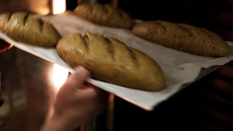 Bread is put to oven Video stock 94165608
