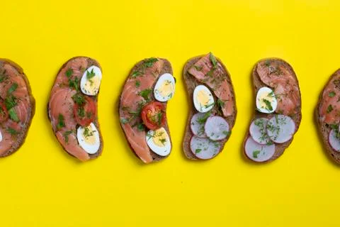 Bread with quail eggs, tomatoes, cucumbers. View from above Stock Photos
