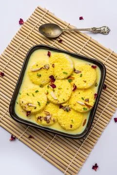 Bread Rasmalai is the tweaked version of traditional Ras malai using bread .. Stock Photos