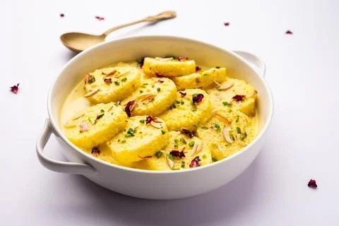 Bread Rasmalai is the tweaked version of traditional Ras malai using bread .. Stock Photos