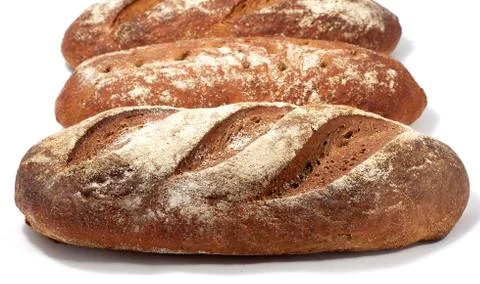 Bread - raye sourdough bread, several loaves nearby. Фото