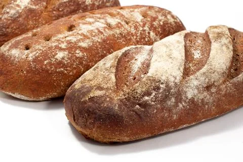 Bread - raye sourdough bread, several loaves nearby. Diagonal composition. 스톡 사진