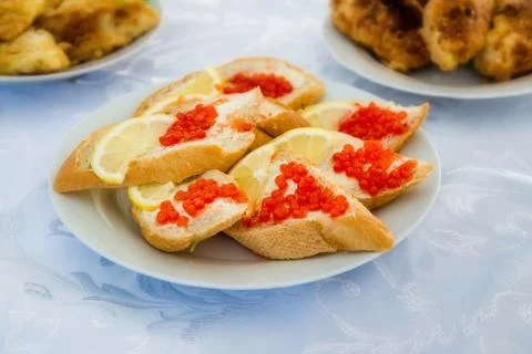 Bread with red caviar Stock Photos