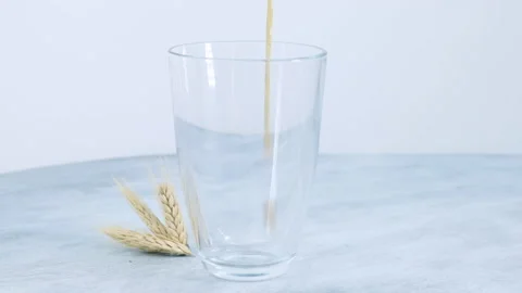 Bread refreshing kvass pours into a glass Stock Footage 133448501