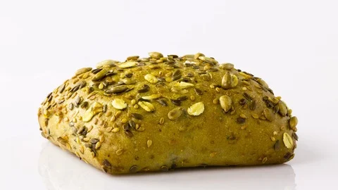 Bread roll bun wholemeal on turntable 스톡 동영상 93071714