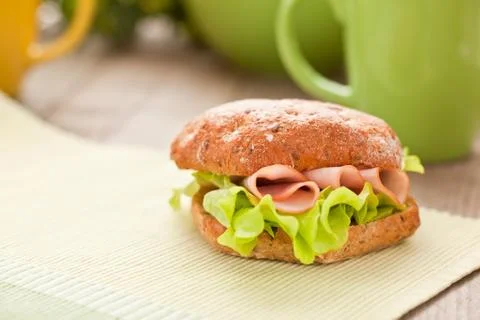 Bread roll with coffee mug on the table Foto stock