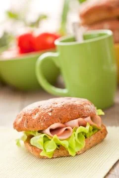 Bread roll with coffee mug on the table Stock-Fotos