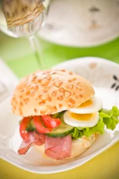 Bread roll with egg slices and lettuce 写真素材