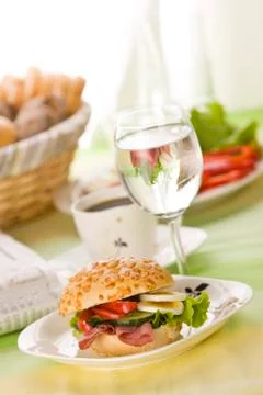 Bread roll with egg slices and lettuce Foto stock