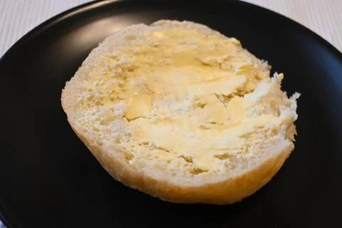 Bread roll with margarine Stock Photos