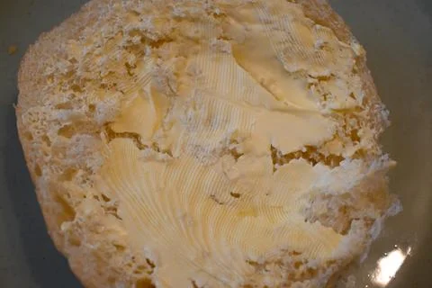 Bread roll with margarine Stock Photos