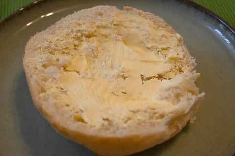 Bread roll with margarine Stock Photos
