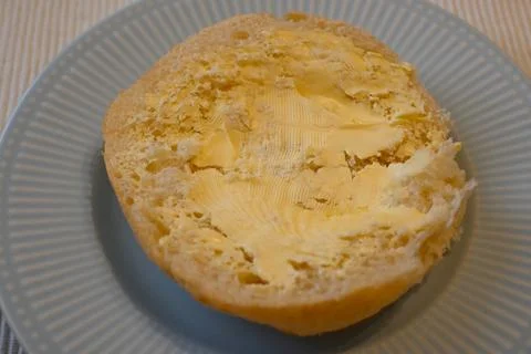 Bread roll with margarine Foto stock